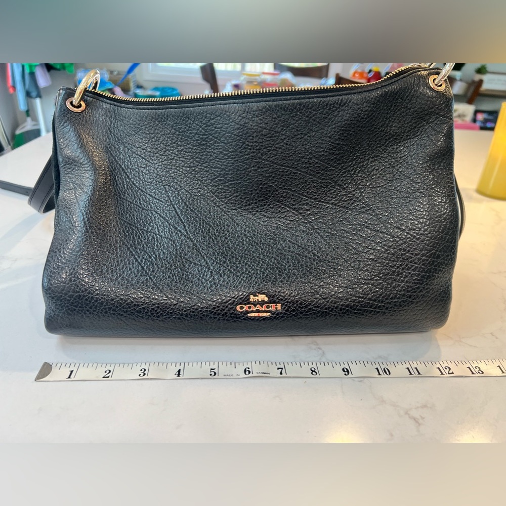 Black leather coach purse, with suede sides.